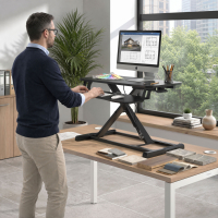 Height-adjustable standing desk converter
