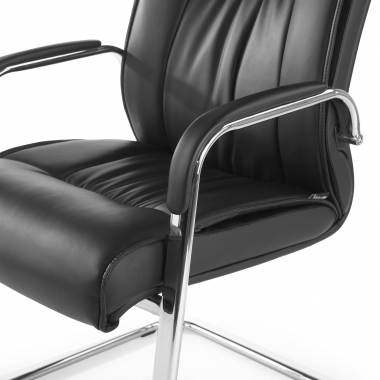 visitor chair black sled base natural leather natural skin upholstered armrests 7