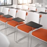 Upholstered chair Hest with writing tablet